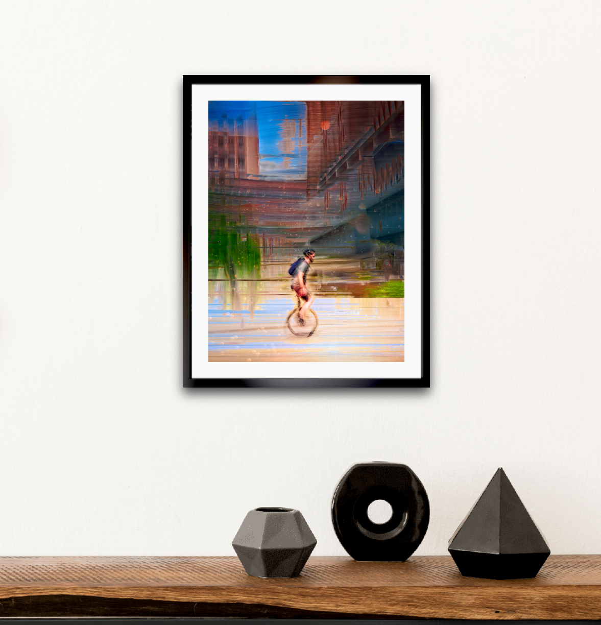 Circus Life person cycling on a unicycle  past Oslo Rådhus Oslo city on there daily commute — ICM photography cycling wall art print by Douglas Carr at Oslo Art Prints. Free worldwide shipping.