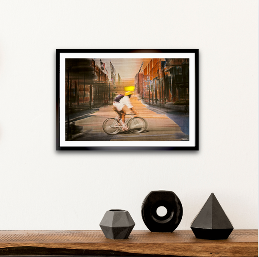 Solar Eclipse, a cyclist riding through Oslo city streets — ICM photography cycling wall art print by Douglas Carr at Oslo Art Prints