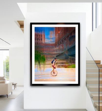 Circus Life person cycling on a unicycle  past Oslo Rådhus Oslo city on there daily commute — ICM photography cycling wall art print by Douglas Carr at Oslo Art Prints. Free worldwide shipping.