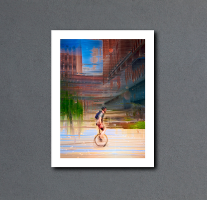 Circus Life person cycling on a unicycle  past Oslo Rådhus Oslo city on there daily commute — ICM photography cycling wall art print by Douglas Carr at Oslo Art Prints. Free worldwide shipping.