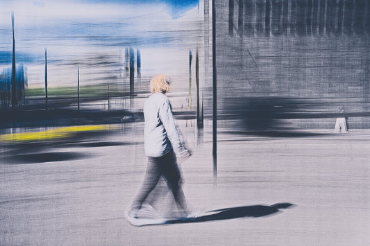 Passing Light a man walking through Oslo city streets pass the National Museum— ICM photography cycling wall art print by Douglas Carr at Oslo Art Prints